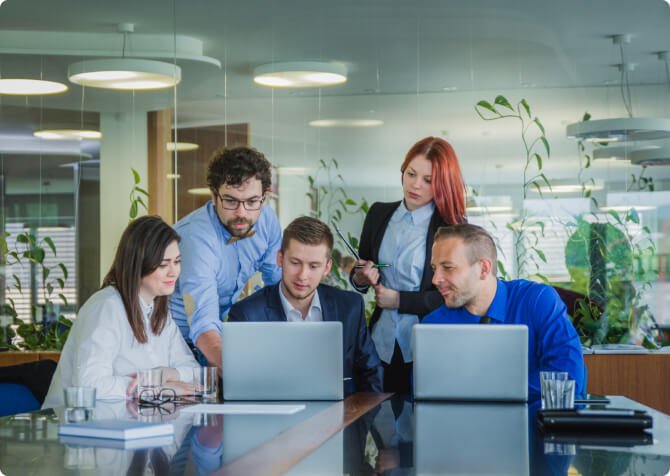 Business team discussing PSARA license consultancy services in office