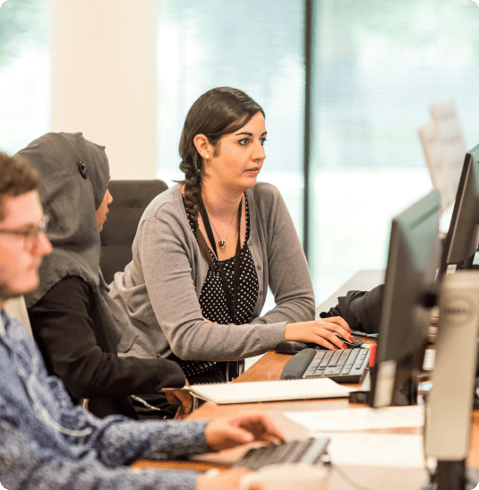 Team working on PSARA license documentation and consultancy services in office